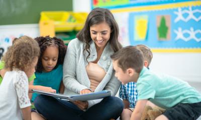 Teacher working with students in a classroom