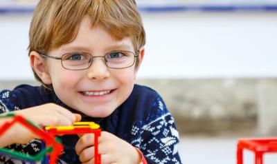 Boy building a structure with toys