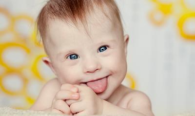Infant sticking tongue out at camera