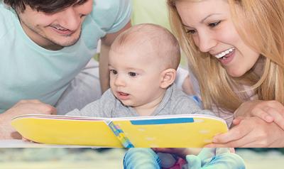 Parents reading to a baby