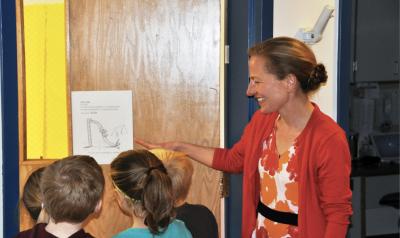 Teacher showing students an illustration