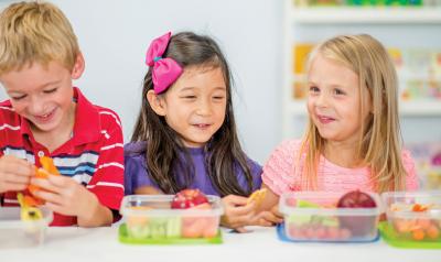 Three children eating lunch
