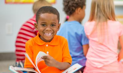 A young boy enjoying a book