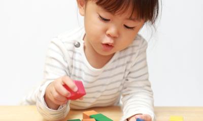 a child playing with blocks