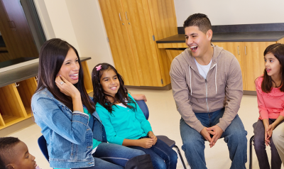 a teacher with students and families