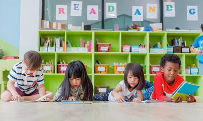 Children reading books on the floor