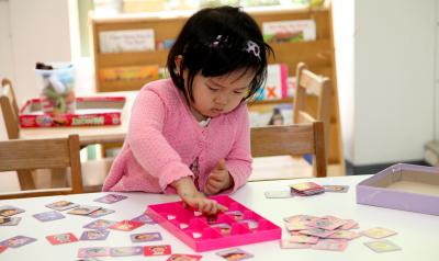 Toddler playing at a table