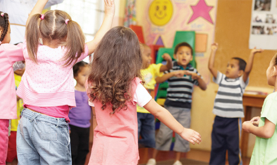 A group of children dancing.