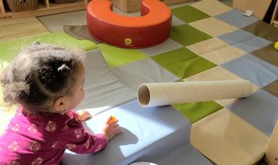 a child playing with a craft in a classroom