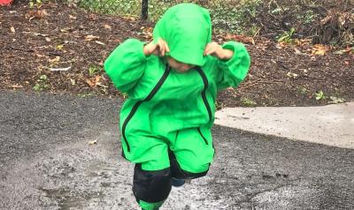 a child playing in the rain