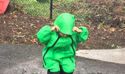 a child playing in the rain