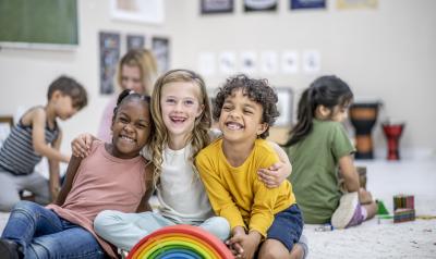 Children posing for a picture in a classroom