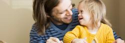 Father and daughter smiling