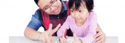 Father and daughter engaging in learning