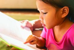 Young child learning to read
