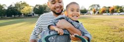 Father and son outside playing