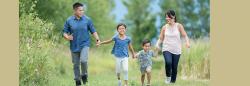 family of four walking oputdoors