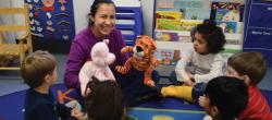 Teacher playing with stuffed animals during circle time