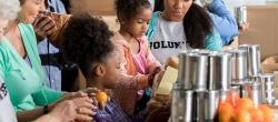 Family helping at a food drive