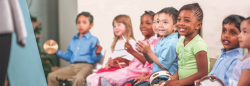 Children playing with musical instruments in class