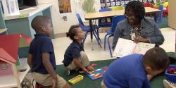 a teacher reading to children