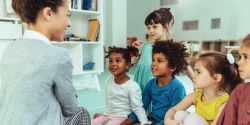 a teacher talking with students