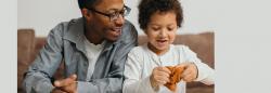 Father and son playing with playdough