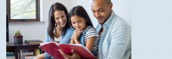 Mother, Father and Daughter reading