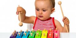 Baby playing on a xylophone