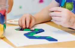 Child playing with shapes