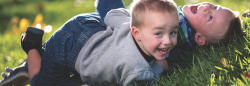 Two children playing outdoors 