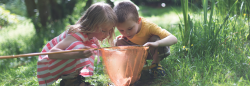 Two children playing outdoors 