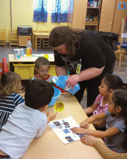 a teacher pouring sugar into a bowl