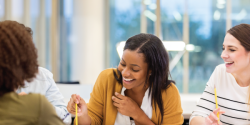 Coworkers laughing in a meeting