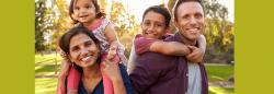 Family of four walking outside together