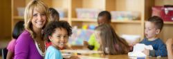 Teacher sitting with preschooler