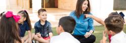 Teacher and students sitting in a circle