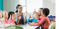 teacher and students engaged in a discussion