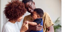 A couple playing with a toddler 