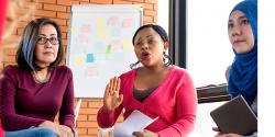 A group of women engaged a round table discussion. 