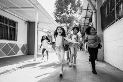 Children running outside at school