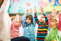 A group of children participating in a lesson 