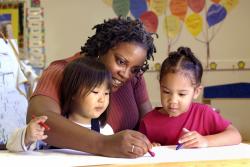 Teacher working with students