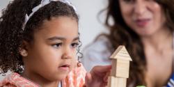 a child playing with blocks