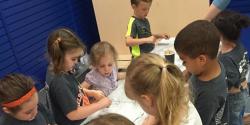 a group of children working together on a science project