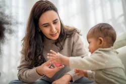 A teaching working with a toddler