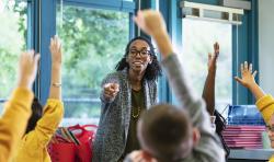 A teacher pointing at a group of students