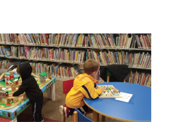 Children playing in play centers at a library