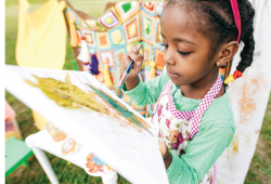 Girl painting on a canvas