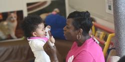 mother and toddler daughter embracing